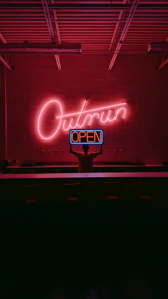 neon sign "open" for outrun brewing